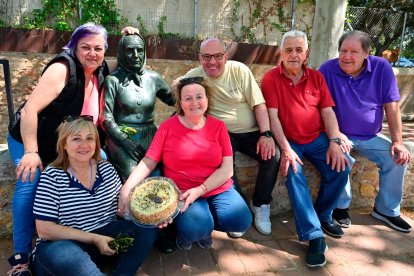 Una família, en el passeig de la Boca de la Mina.