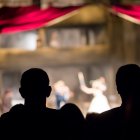 audience in the theater watching a play