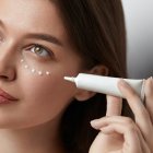 Eye Skin Care. Beautiful Woman Applying Eye Cream On Skin Under Eyes. High Quality