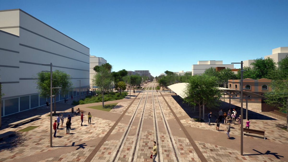 Vista de detalle de la integración del trazado del tranvía, con el pavimento en líneas diagonales y arbolado.